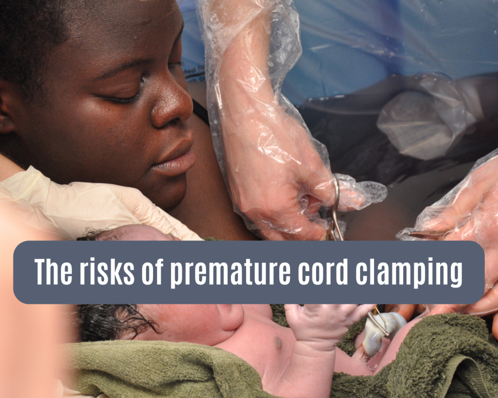 A mother and baby in a birth pool. The baby's umbilical cord is being clamped, ready to be cut.